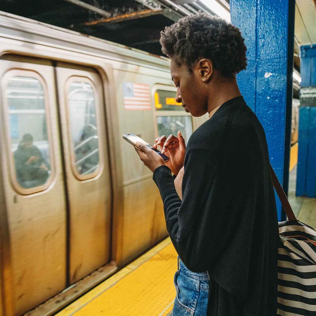 Young woman waiting for subway train