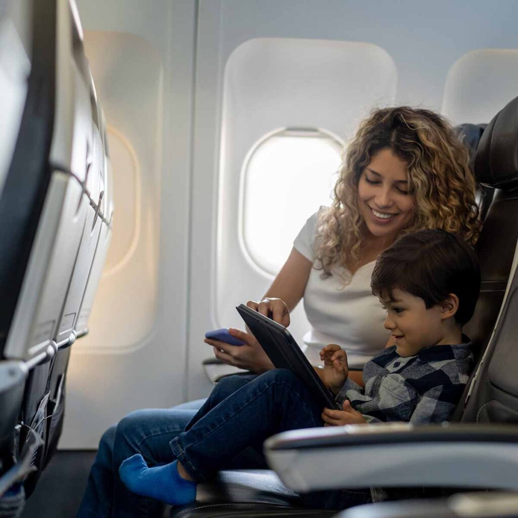 Young woman and child on airplane