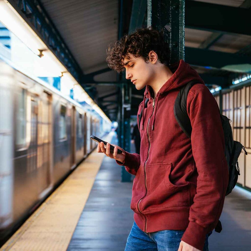 Young man waiting for subway